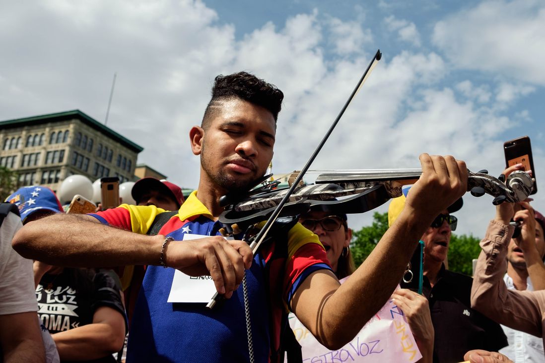 Wuilly Arteaga, 24, now famous for playing his violin in the middle of Venezuela's deadly protests last year against President Nicolas Maduro. He said he got to New York after being tortured for his role at the protests. During the rally at Union Square in support of Venezuela, he played the National Anthem.</br>
